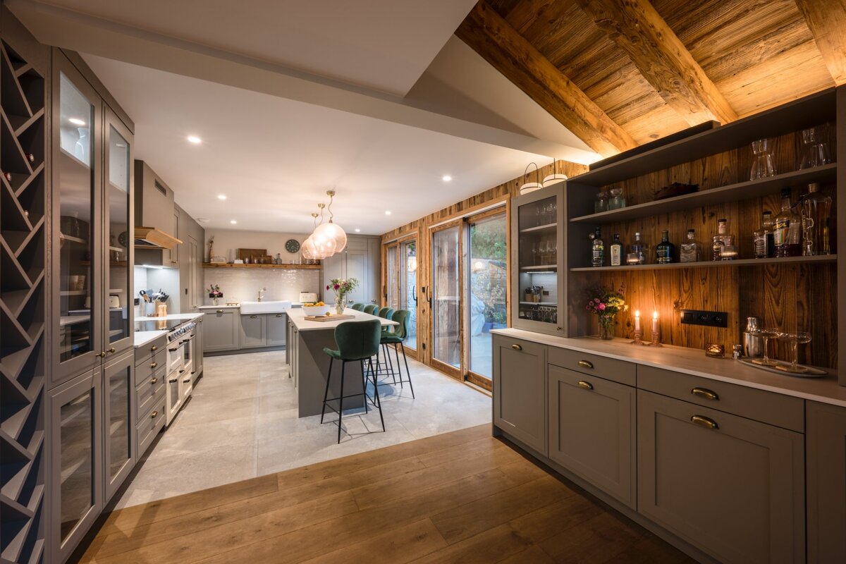 A kitchen with a bottle of gin on the shelf