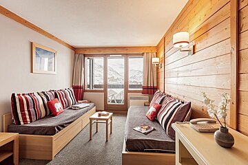 A living room with a couch and a table