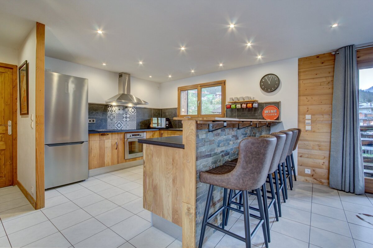A kitchen with a sign that says wine on it