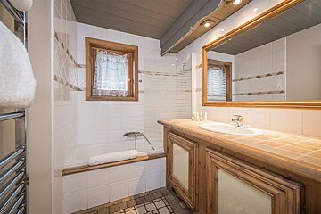 A bathroom with a sink and a bathtub
