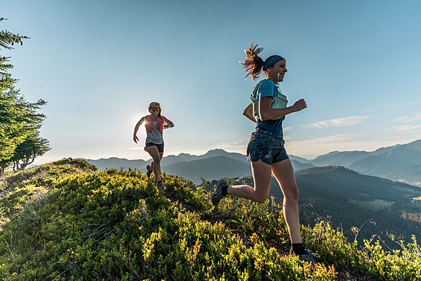 Ladies trail running in the sunshine in Morzine