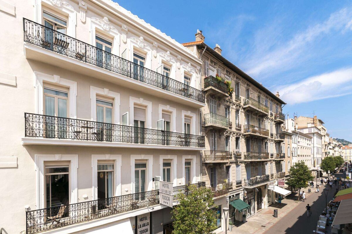 A building with balconies and a sign that says la villa terra