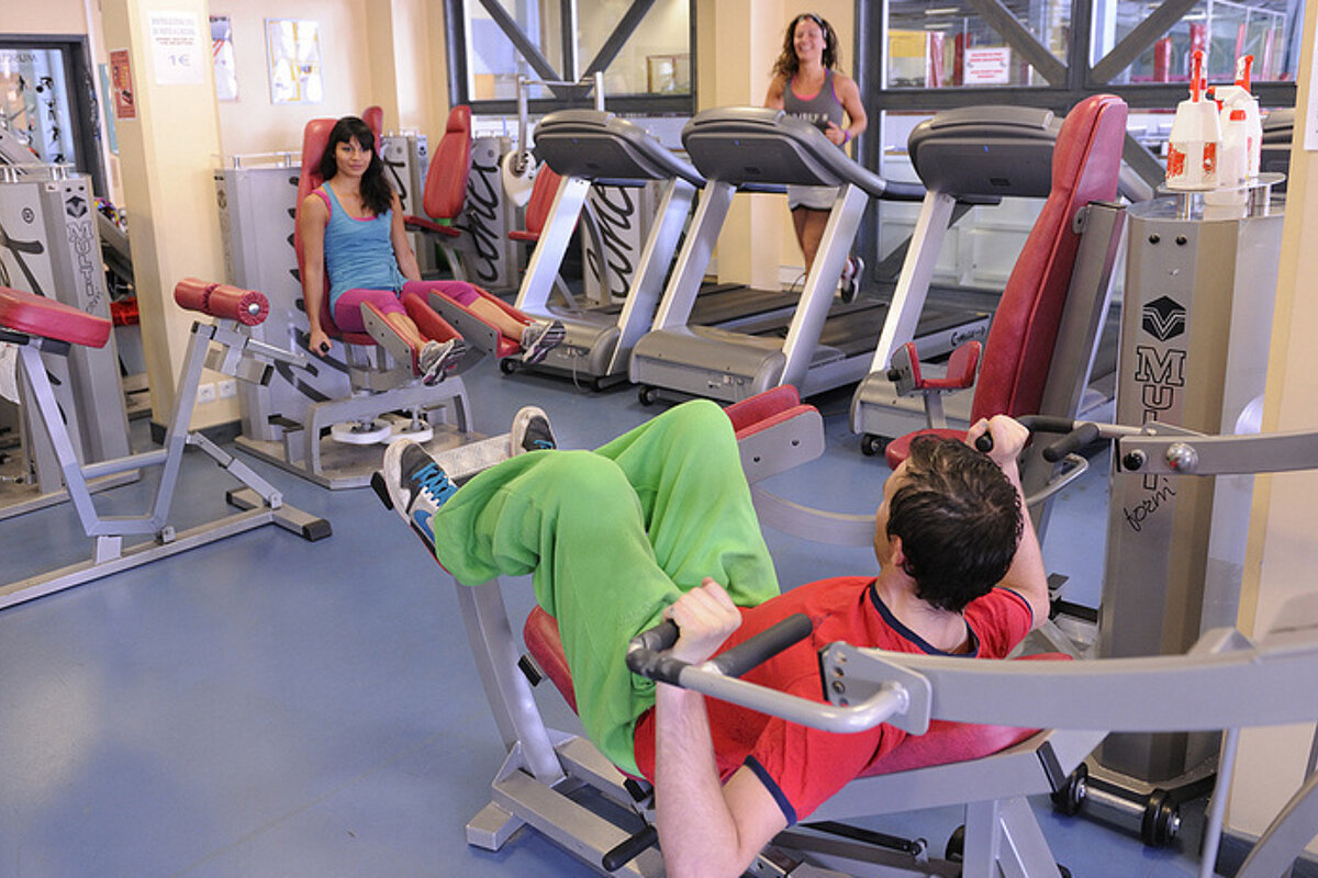 A man is using a machine that says mu on it