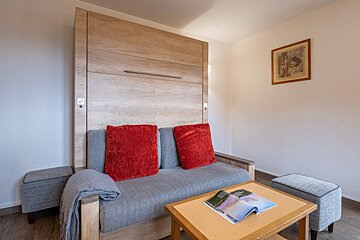 A living room with a couch and a coffee table