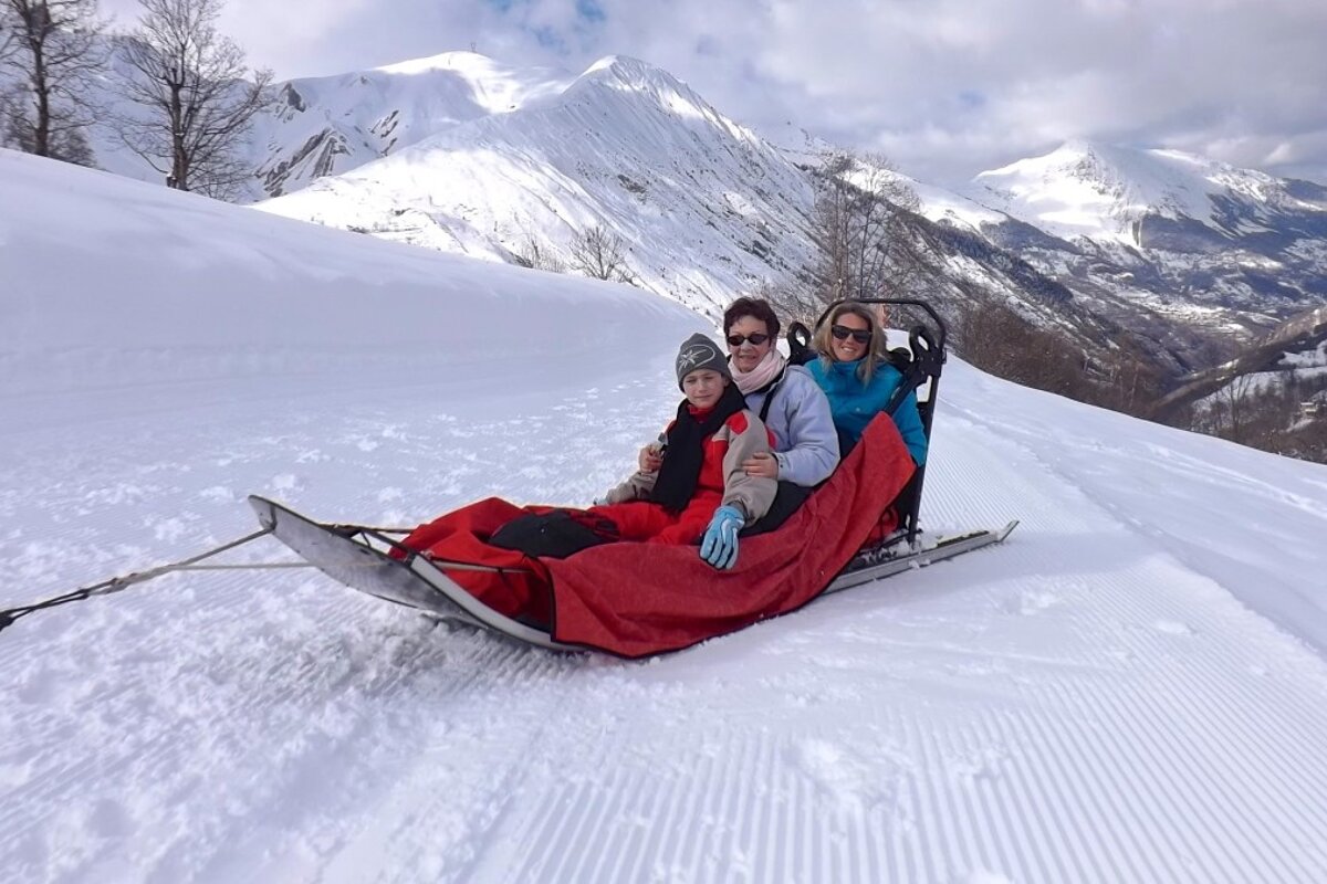 a group of people on a sled