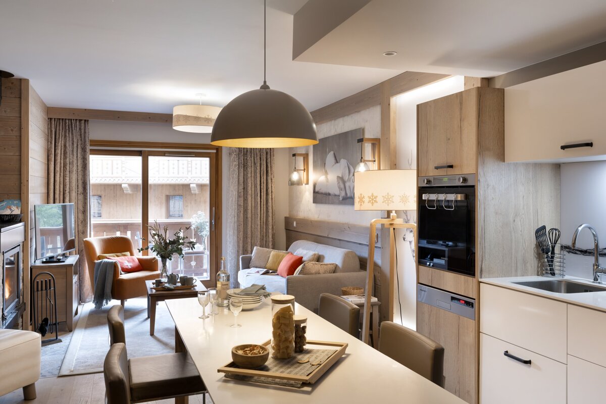A living room with a dining table and chairs