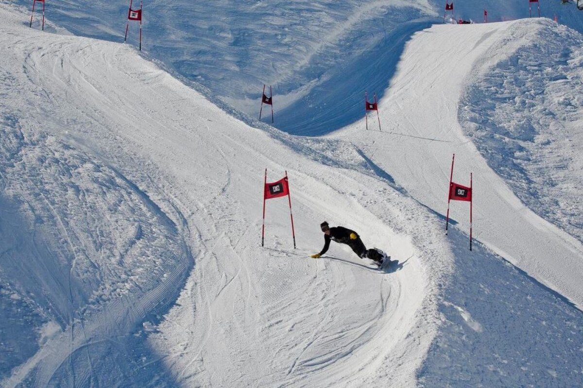 a snowboarder on a boardercross track