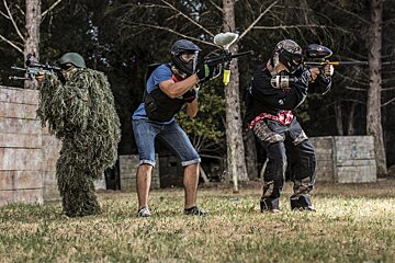 three people in paintball gear