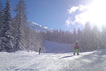 a snowboarder on piste in les arcs