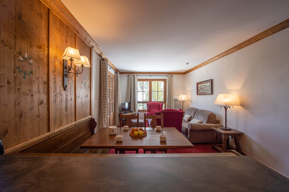 A living room with a couch and a table