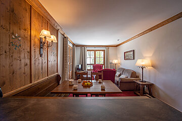 A living room with a couch and a table