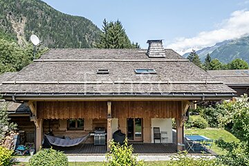 A house with a satellite dish on top of it
