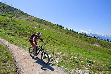 a female mountain biker on a trail