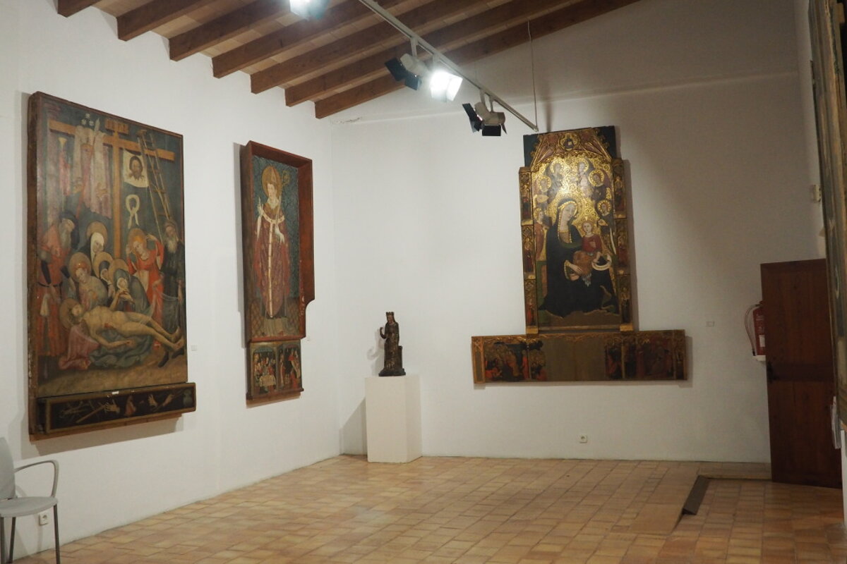 old style painting on the walls in a museum