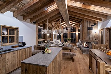 A kitchen with wooden cabinets and a granite counter top