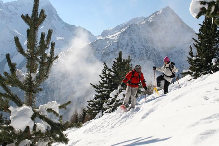 a couple snow shoeing