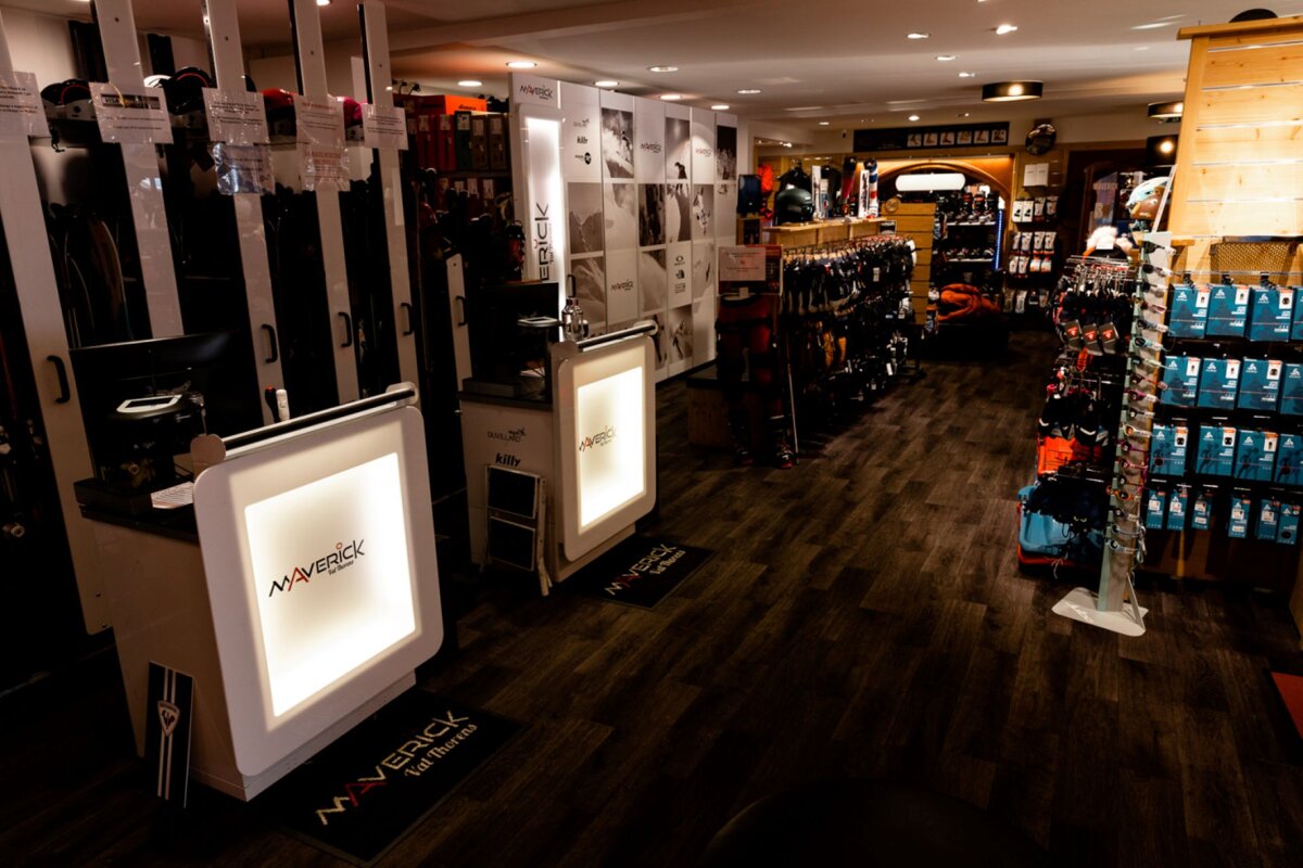 The inside of a store with a counter that says maverick