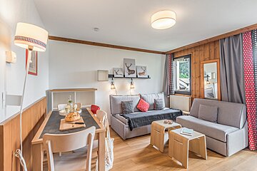 A living room with a couch and a table