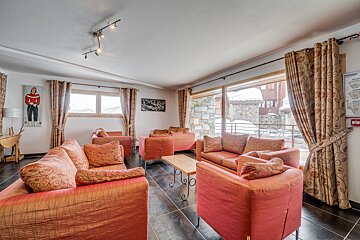 A living room with a fire extinguisher on the wall