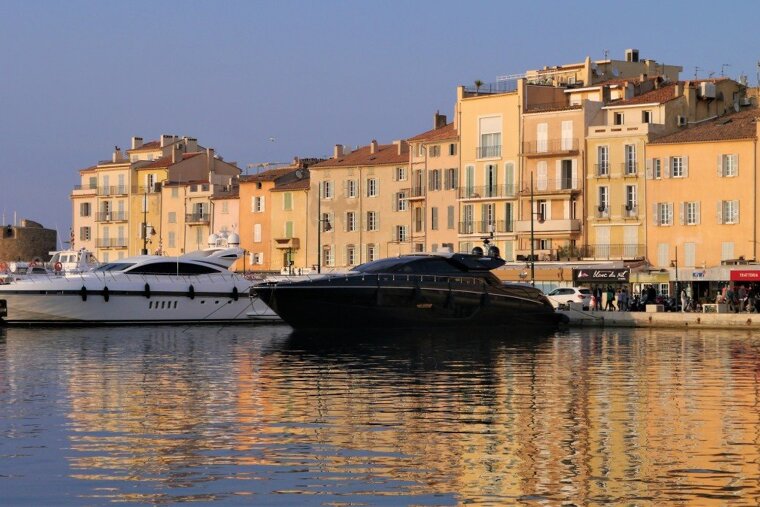 white & black yachts in st tropez harbour