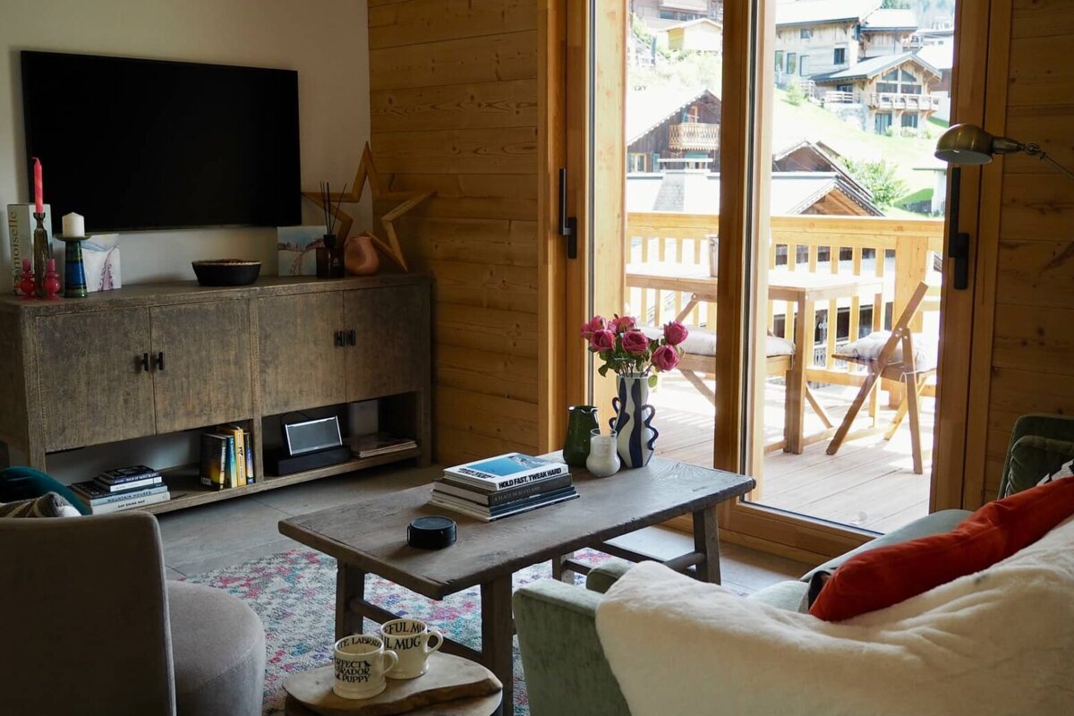 A living room with a coffee table and a tv