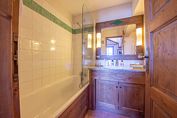 A bathroom with a bathtub and a sink