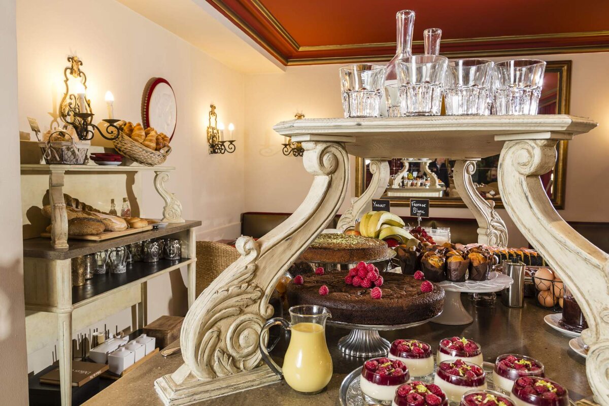 A buffet table with a sign that says ' raspberry ' on it