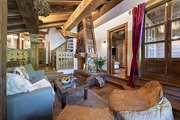 A living room with a fireplace and a couch