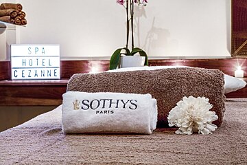 A sothys towel sits on a massage table