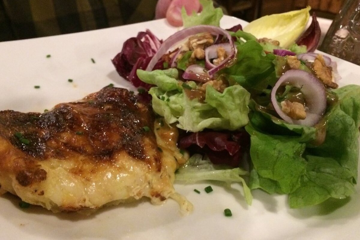 cheese slice and salad on a white plate