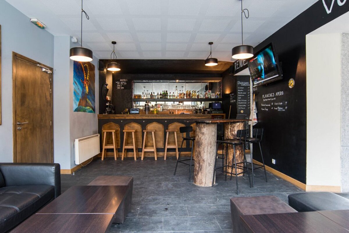 A bar with a menu written on the wall