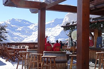 a terrace at a restaurant in les menuires