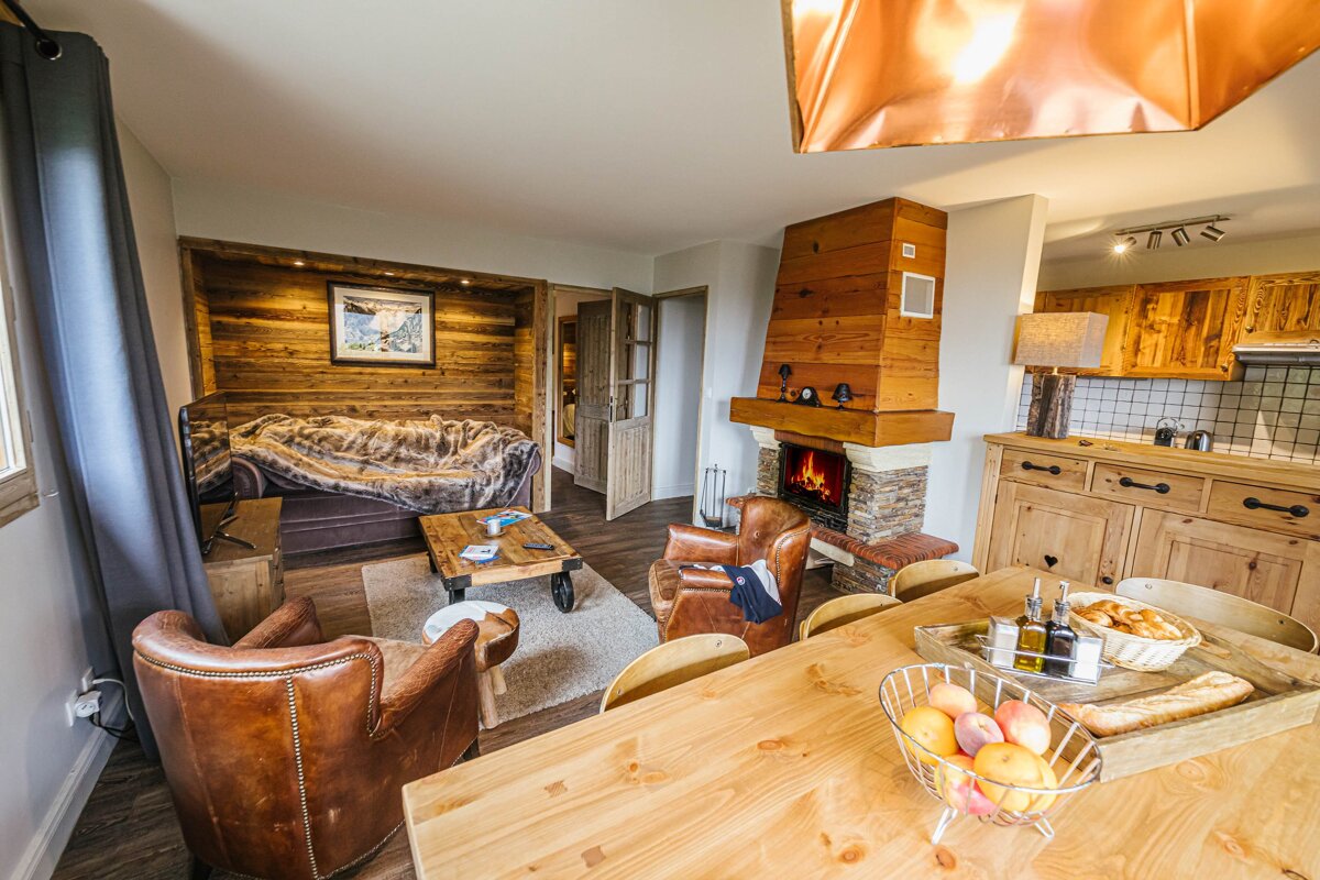 A living room with a fireplace and a couch