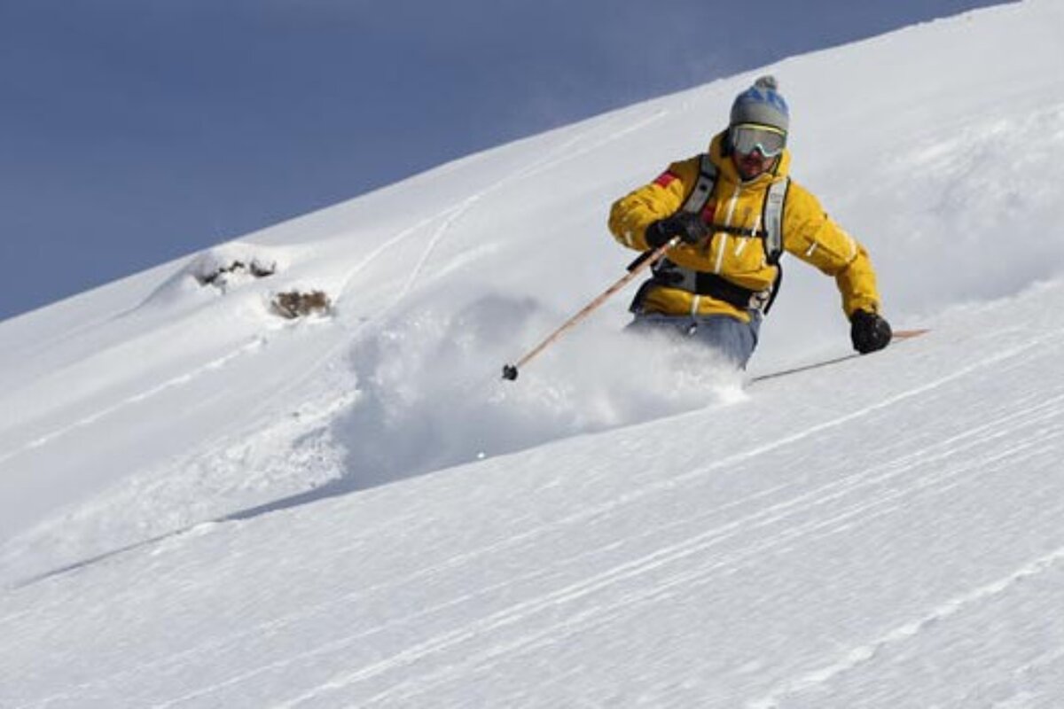 a skier in deep powder off piste