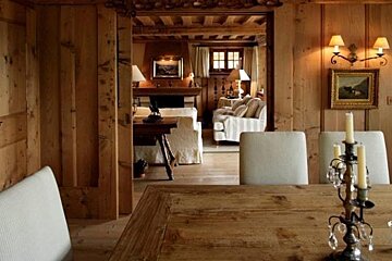 a dining table and chairs in a chalet