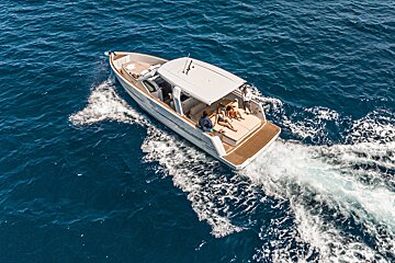 An aerial view of a boat in the ocean