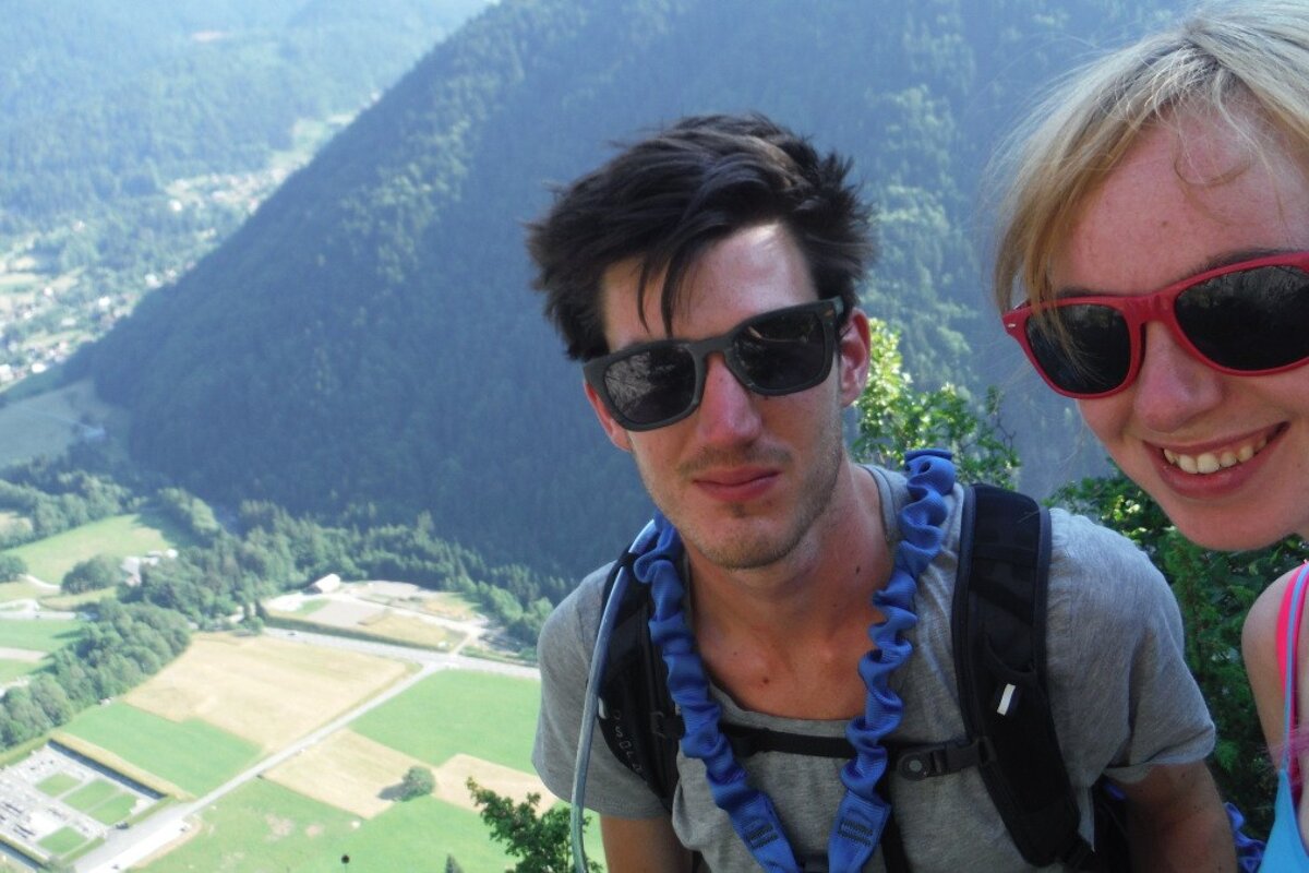 two people at the top of a mountain