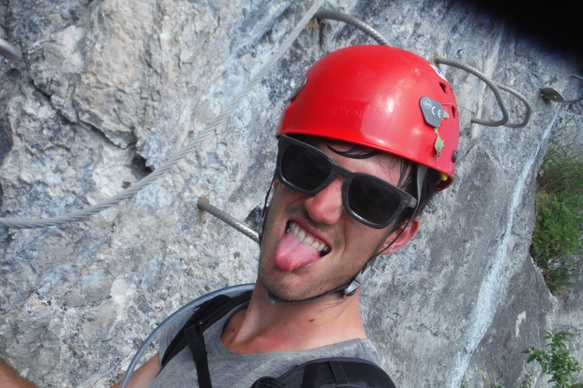 a man in a red helmet sticking his tongue out