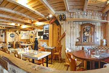 A restaurant with a coca cola sign on the wall