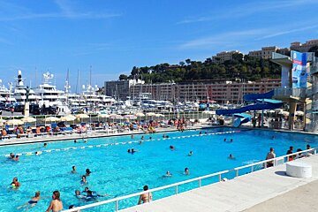 a busy swimming pool in Monaco