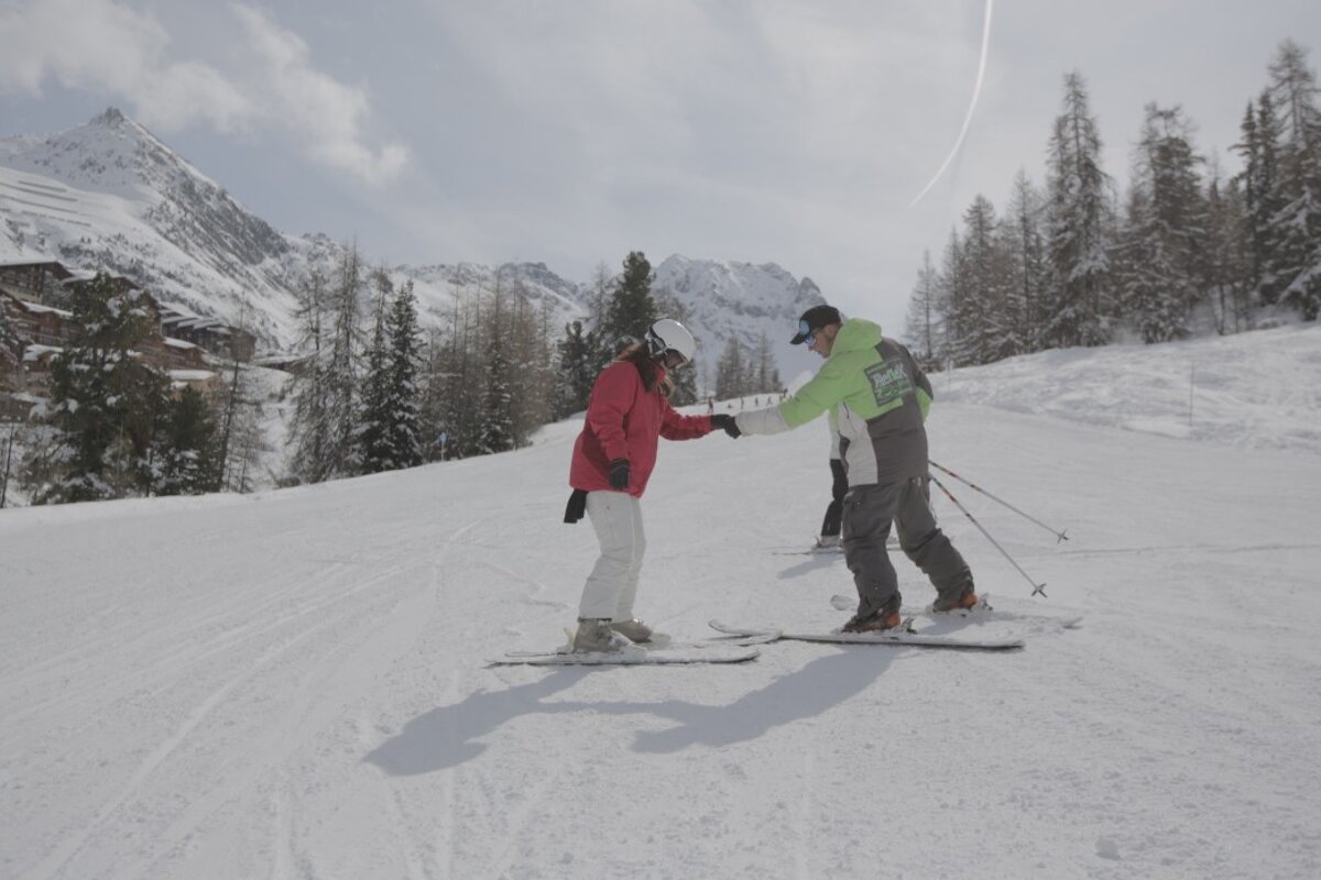 a ski instructor giving a private lesson