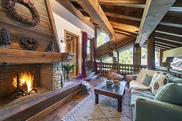 A living room with a fireplace and a couch