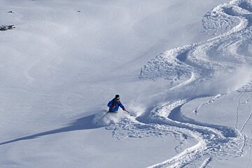 a skier in deep powder