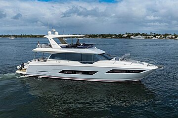 A large white yacht is floating on the water