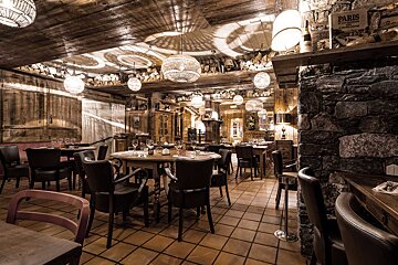 A restaurant with a bottle of paris on the shelf