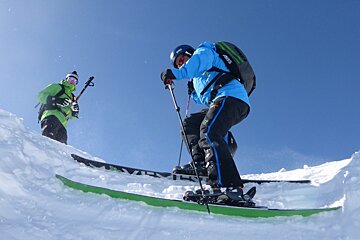a man side stepping on his skis