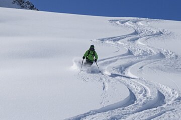 a skier in fresh snow in st foy