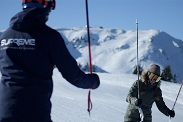 a ski instructor giving a private lesson