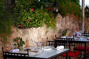 A restaurant table with plates and glasses on it