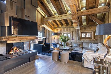 A living room with a fireplace and a flat screen tv
